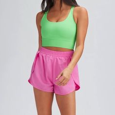 Double Layer Shorts With A Tight Biker Under And Loose Sport Short Top Layer With Functional Pockets. Made Of Woven Jersey. High Rise Double Layered 88% Polyester, 12% Woven Jersey Made In The Usa Machine Wash Cold, Lay Flat To Dry Pink Crop Sporty Tops, Sporty Pink Short Length Top, Sporty Short Length Pink Tops, Summer Gym Tops Short Length, Seamless Athleisure Shorts For Summer, Spring High-waisted Shorts Activewear, Seamless Sports Shorts For Summer, Pink Short Length Top For Sports, Pink Short Length Workout Top