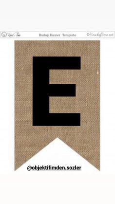 the letter e is made out of burlocked fabric and has a black font on it