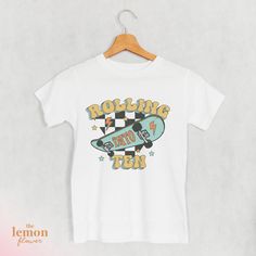 ♥ WELCOME TO THE LEMON FLOWER SHOP ♥ ------------------------------------------ PRODUCT ------------------------------------------ Looking for the perfect gift? Check out this awesome Skateboard T-Shirt designed for 10-year-olds! Whether they're out having a blast with friends or just hanging out, this tee adds a touch of skatepark style to their look. Made for comfort, it's the ideal present for young skaters who know how to rock their outfits. Get yours now and let the good times begin! ------------------------------------------ MATERIAL ------------------------------------------ Bella + Canvas Youth Staple Tee is light, comfy, and has just the right amount of stretch youngsters need for an active lifestyle. ⇢ 100% Airlume combed and ring-spun cotton ⇢ Heather colors are 52% combed and r Retro White T-shirt For Birthday, Old Skateboard, Skateboard Birthday, Lemon Flower, Tenth Birthday, Skateboard Tshirt, Having A Blast, Birthday Shirt, Active Lifestyle