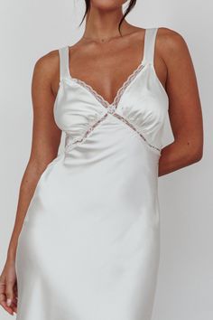 Shop the Nyah Lace Trim Midi Dress Off White | Selfie Leslie Satin Midi Dress With Lace Trim, Satin Midi Length Dresses With Lace Trim, Bridesmaid Lace Midi Dress With Lace Trim, Chic Lace Trim Midi Dress For Wedding, Fitted Lace Patchwork Slip Dress For Weddings, Chic Wedding Midi Dress With Lace Trim, White V-neck Slip Dress With Lace Trim, Feminine Midi Length Slip Dress With Lace Trim, Feminine Midi Slip Dress With Lace Trim