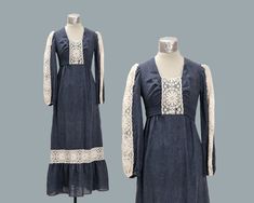 This vintage, PBJ by Jerell , gunnesax style dress is just exploding with detail; the most obvious being the soft, ivory, lace that lines the arms, neckline, and skirt of the dress. The lace has large daisies that bring a summery, country-side look to it! Although the fabric appears to be denim, it is actually soft and linen-like, which makes it breathable for those warm, summer days. There are also ribbons at the waist that can tie in the back to fit to your waist perfectly.  Sizing:  Bust (Arm Fall Vintage Fitted Dress With Lace Trim, Fitted Vintage Dress With Lace Trim For Fall, Fitted Bohemian Prairie Dress For Fall, Cottagecore Lace Fitted Prairie Dress, Victorian Fitted Prairie Dress For Spring, Fitted Victorian Prairie Dress For Spring, Fitted Prairie Dress With Lace Trim For Fall, Fitted Vintage Lace Dress For Spring, Country Side