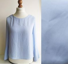 A lovely vintage blouse. In light baby blue fabric. Very feminine and excellent for Spring/Summer. Very pretty. Has bell sleeves. Size: women's M /Eu 38Measurements of it laying flat:sleeve- 58cm/ 22.8inlength- 66cm/ 25.9inpit to pit- 51cm/ 20inExcellent vintage condition! PolyesterCheck out my other items:https://www.etsy.com/shop/NAAMII Fitted Long Sleeve Light Wash Blouse, Vintage Satin Dress, Blouse Simple, Spring Blouse, Long Cardi, Light Blue Blouse, Blouse Summer, Spring Blouses, Bohemian Blouses