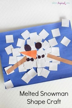 a snowman shape craft made out of construction paper and cut into squares to make it