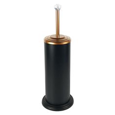 a black and gold toilet brush holder with a diamond on the top in front of a white background