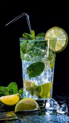 a glass filled with ice and lemon slices