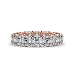 a rose gold ring with baguetts and diamonds