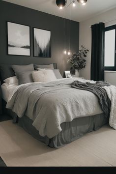 a bedroom with gray walls and white bedding