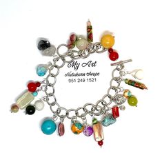 Elevate your style with this exquisite handcrafted bracelet featuring 21 distinct gemstones. Each stone is carefully wired wrapped and adorned with dangling charms on a chic chain. The toggle clasp ensures a secure and stylish finish. Embrace the beauty of variety with this adjustable bracelet, a perfect statement piece for any occasion. Adjustable 7-10 inches Multicolor Dangle Charm Bracelet, Handmade Multicolor Dangle Charm Bracelet, Bohemian Charm Bracelet With Dangling Charms, Handmade Dangle Charm Bracelet For Jewelry Making, Handmade Bohemian Dangle Charm Bracelet, Bohemian Multicolor Dangle Charm Bracelet, Bohemian Dangle Charm Bracelet For Jewelry Making, Artisan Dangle Charms Jewelry, Eclectic Jewelry With Natural Stones