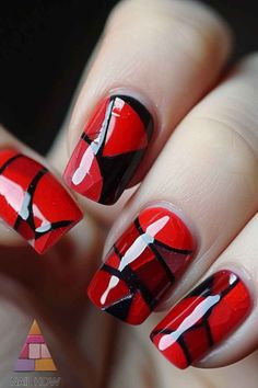 These red nails with black geometric patterns are perfect for a chic and modern fall style. The glossy finish adds a touch of elegance. Visit NailHow.com for more trendy nail designs and save this pin to your board! Red Nails With Black, Modern Fall Style, Nails With Black, Trendy Nail Designs, Modern Fall