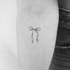 Small Ribbon Bow temporary tattoo.  - Set of three. - Size: 1.3 in / 3.4 cm (height) - Tatteco temporary tattoos last on average 2-5 days - We suggest placing on oil-free areas where skin does not stretch and keep them clean - Environmentally friendly (tattoos and packaging made out of paper, no plastic layer) - Free shipping in order over €10: FREESHIPOVER10 - 20% off when you buy 3 items (+ Free Shipping ): 3PLUS Thank you for reading! Long Bow Tattoo, Tiny Bow Tattoo, Cute Bow Tattoo, Bow Tattoo Back Of Leg Ribbons, Dainty Ribbon Bow Tattoo, Small Bow Tattoos