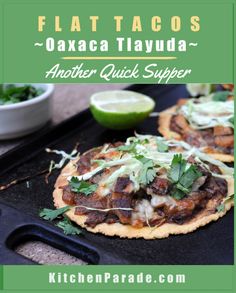 two mexican style flatbreads with meat and cilantro garnishes