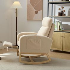 a rocking chair in a living room with a lamp on the side table next to it