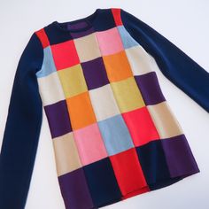 "Unique colorful patchwork vintage sweater! Super cute fitted sweater that feels like a wool blend with a ton of stretch.  Navy blue background with FUN  colorful squares on both front and back! Vintage 60s/70s, but super modern as well :)  Brand: Vintage (no tag) Size: No tag. Best for Small Approximate measurements: 17\" from armpit to armpit 22.5\" long 17\" sleeve length (from underarm to end) Condition: REALLY GOOD vintage" Retro Patchwork Knit Sweater, Fitted Patchwork Sweater For Fall, Fitted Long Sleeve Patchwork Sweater, Retro Patchwork Sweater For Fall, Blue Patchwork Crew Neck Sweater, Fall Retro Patchwork Sweater, Blue Knit Sweater With Patchwork, Fitted Patchwork Sweater For Winter, Colorful Patchwork Top For Fall