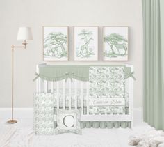 a baby's room with green and white decor