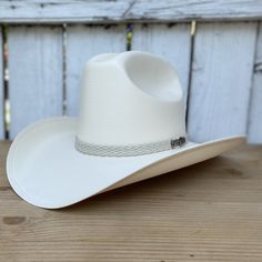 Country Style Top Hat With Curved Brim For Ranch, Country Style Top Hat With Curved Brim, Western White Hat With Curved Brim, Western Style Panama Hat With Curved Brim, White Western Panama Hat With Curved Brim, White Western Hat With Short Brim, Classic White Straw Hat For Ranch, Western Short Brim Panama Hat For Rodeo, Western Style Sun Hat With Curved Brim For Ranch