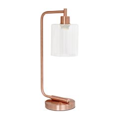 the copper table lamp has a clear glass shade and is on an adjustable metal stand