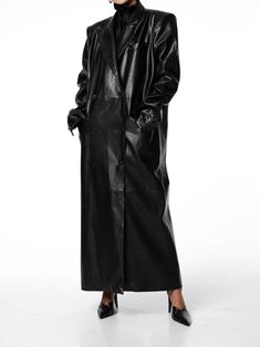 Classic double breasted vegan leather coat with peaked lapel. Maxi length. Button and pocket details. Model is wearing MINUSEY ONE SIZE. ✔️ Free worldwide express shipping over $100✔️ Loved by 6,500+ customers✔️ Limited edition collections, maximum style⠀⠀⠀⠀⠀⠀⠀⠀⠀Stay ahead of the trend with can’t-find-anywhere-else staples. Your closet will thank you 💕 MINUSEY ONE SIZE = EU 34-38, US 2-6 100% PU Leather Dry clean Made in Korea - Model Height: 172cm/5'7" (US 2, EU 34) Sleek Double-breasted Outerwear With Buttons, Winter Leather Jacket With Double-breasted Button, Sleek Double-breasted Outerwear With Lapel Collar, Winter Leather Outerwear With Double-breasted Buttons, Formal Winter Leather Jacket With Double-breasted Buttons, Winter Leather Double-breasted Outerwear, Trendy Black Outerwear With Double-breasted Button, Leather Long Coat With Double-breasted Button, Elegant Winter Leather Jacket With Double-breasted Fastening