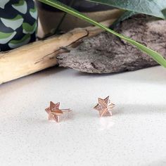 Our Star stud earrings are destined to be your new favorite way to complete your look. Wear these as a simple accent to your favorite t-shirt and jean or use it in a second piercing paired up with a hoop for an edgier look.  ASTOR + ORION exclusive Rose gold dipped earrings Sustainably cast from 70% recycled stainless steel Measures 10 mm wide and 10 mm high Post closure Nickel free and hypoallergenic Hand Sculpted with love in Seattle Free shipping on orders over $75 Fast & Friendly Returns Rose Gold Star Charm Earrings, Rose Gold Star Earrings With Star Charm, Rose Gold Star-shaped Earrings With Star Charm, Rose Gold Star Earrings For Gift, Rose Gold Earrings With Star Charm As A Gift, Minimalist Rose Gold Star Earrings, Rose Gold Star-shaped Dainty Earrings, Dainty Star-shaped Rose Gold Earrings, Dainty Rose Gold Star Earrings