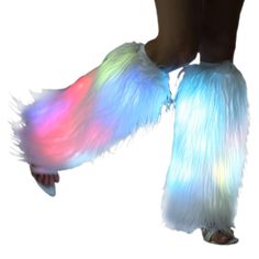 a pair of feet with white and blue feathered leg warmers on top of them