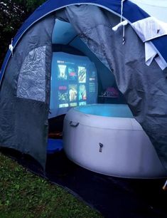 an inflatable tent is set up outside on the grass