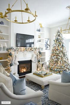 a living room filled with furniture and a christmas tree in front of a fire place