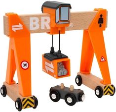 an orange toy truck with construction equipment attached to it