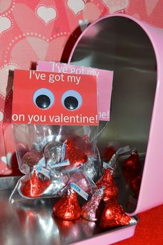 valentine's day candy in a pink box with i've got my on you valentine card