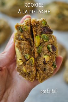 a person holding up a cookie in their hand with the words cookies la pistaache on it