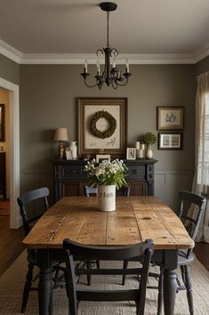 a dining room with a wooden table and chairs