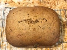 a loaf of bread sitting on top of a cooling rack