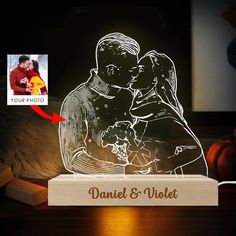 a personalized night light with an image of a man and woman holding each other