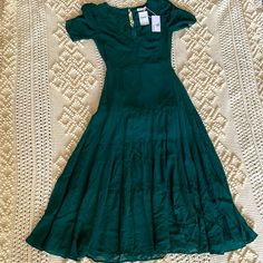 Reformation Emerald Green Cosa Ruched Sleeve Tiered Deep V-Neck Midi Dress Size 6 New With Tags Never Used. Green Ruched Tiered Midi Dress, Green Tiered Ruched Midi Dress, Ruched Sleeve, Reformation Dress, V Neck Midi Dress, Reformation Dresses, Deep V Neck, Deep V, Emerald Green