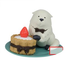 there is a cake with a white bear on it and a red strawberry in the middle