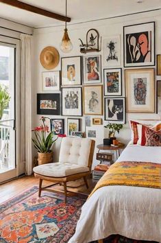 a bed sitting in a bedroom next to a window filled with pictures on the wall