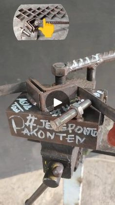 a close up of a metal object with words on it and an arrow pointing to the right