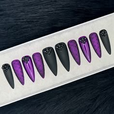 "This listing is for a set of matte black and dark purple jelly press on nails with lattice and rhinestone detail. This set can be customized to shape and size preferences. PLEASE READ PRODUCT DESCRIPTION BEFORE ORDERING: \"Dark Majesty\" Introducing a regal and enchanting set of press on nails that exude an air of gothic grandeur. Prepare to embrace the darkness with this set, adorned with an aura of majestic allure. The thumb and pinky nails, cloaked in a velvety matte black, emanate power and sophistication. Adorned with exquisite black rhinestones at the base, these nails are the epitome of dark royalty.  The pointer and ring fingers beckon with a matte dark purple jelly, reminiscent of an amethyst sky. Delicate black lattice detail weaves an intricate web of mystery, showcasing the de Glitter Matte Nails, Beaded Nails, Jelly Press On Nails, Ongles Goth, Black And Purple Nails, Dark Purple Nails, Nails Rhinestones, Nails Edgy, Black Glue