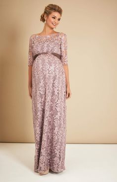 Made from beautiful vintage-inspired sheer lace, the Asha in Lilac is a stunning floor-length gown. From Baby Shower to Bridesmaid, with a stylish boat neckline, sheer ¾ length sleeves and dramatic full skirt that drapes over your bump, you’ll look and feel amazing at the most special of occasions. •Premium embroidered tulle in lilac •Floor length gown with ¾ sleeves •Empire waist with gentle gather over the bump •Sheer neckline and sleeves •Fully lined with premium jersey •Add a sash to define Lace Maternity Wedding Dress With Scalloped Lace, Floor-length Lace Gown For Mother Of The Bride, Lace Maternity Maxi Dress For Wedding, Lace Maternity Dress With Lace Bodice For Wedding, Maternity Wedding Dress With Lace Bodice, Wedding Maternity Dress With Lace Bodice, Elegant Lace Maternity Wedding Dress, Lace Maxi Dress For Mother Of The Bride, Rose Tiffany