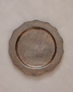 a metal plate sitting on top of a white table