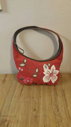 Preston and York, Red Suede and Brown Crossbody Bag with Embroidered Flower Design, Designer Bag This is in great shape with minor wear and tear.  This is 14 inches long, 9.5 inches tall and 1 inch wide. The straps measure another 9 inches from the top the bag to the bottom of the strap. Check out our shop for monthly specials. We have a variety of items for every taste. Combine several of our items together to save on shipping. If you have any questions please do not hesitate to ask. I will ship outside of the US, just request a quote. Happy Shopping. I will work around the priority mail price. Just send me your zip code and I will get a quote. As shop owners we will do our best to describe any issues or problems with our items. Since we do sell vintage and antiques there may be some flaw Red Embroidered Pouch Bag, Red Floral Embroidered Tote Shoulder Bag, Red Floral Embroidery Tote Shoulder Bag, Red Tote Bag With Floral Embroidery, Red Floral Embroidered Tote Bag, Red Bags With Floral Embroidery For Daily Use, Red Embroidered Handheld Bag, Red Floral Embroidered Bag For Daily Use, Red Embroidered Bag For Daily Use