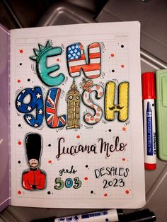 an open notebook with the words edd aussie written in english and some markers