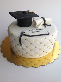 a cake with a graduation cap and diploma on top