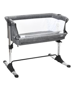 a baby crib that is on top of a metal stand with wheels and handles