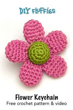 a crocheted flower is shown with the words, flower keychain free crochet pattern & video