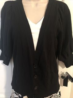 AGB Black Sweater Cardigan Size M NWT. Really cute sweater! Has 4 front buttons . More of a open sweater for over a shirt, camisole,or dress. Has pleated balloon sleeves that are mid bicep. Fabric does have stretch to it. It’s in excellent condition and has the tags attached. Trendy V-neck Sweater For Work, Spring V-neck Sweater With Button Closure, Trendy V-neck Sweater For Spring Workwear, Chic Spring V-neck Sweater For Workwear, V-neck Top For Daywear In Fall, Trendy V-neck Cardigan For Layering, Spring V-neck Cardigan For Layering, Elegant Cotton V-neck Cardigan, V-neck Cardigan For Layering