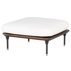 the ottoman is made from wood and has a white cushion on it, with black legs