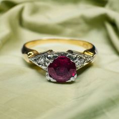 SAME DAY SHIPPING A Solid 14k Gold ring, this antique Edwardian Era Engagement Ring Wedding Ring has 2 diamonds & one Main Ruby, main stone is approx. 1/3 Carat 4.4x4.4mm. The ring is Approximately a size 5.25. The setting is absolutely gorgeous and the ornate band is elegantly designed! The stones feel ethereal. Band measures approx. 2.5mm. This would be perfect for anyone who adores the beauty an antique ruby and diamond ring provides! Weighs approximately 1.9g. Would make an excellent gift! W Alternative Engagement Rings Vintage, Emerald Pendants, Rings Birthstone, Milgrain Engagement Ring, Georgian Ring, Rings Sapphire, Edwardian Engagement Ring, Diamond Ring Wedding, Jewelry Ruby