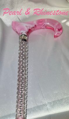 "Luxury pearl & rhinestone pink walking cane is covered from top to bottom with with shimmering bling from top to bottom. Light weight and has a stylish pink and white derby handle with the rhinestone ring at the handle base! Zoom in for detail!! *8This is a brand name cane that I applied this beautiful pearl and rhinestone mix to. Adjustable in height from short to tall. Unique & thoughtful gift for loved ones with balance issues or post surgery! Go to that party or wedding in style! Don't fret Luxury Bedazzled Party Embellishments, Gifts With Bling, Bedazzling Ideas, Glow Shoes, Matching Hoodies For Couples, Arizona City, Bling Ideas, Bottom Light, Party Favors For Adults