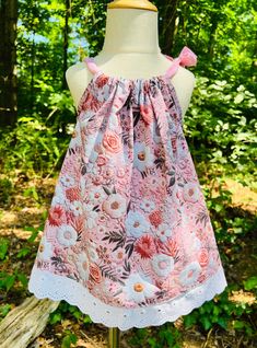 a dress on a mannequin in the woods