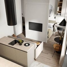 an aerial view of a living room and kitchen area in a modern apartment with wood floors