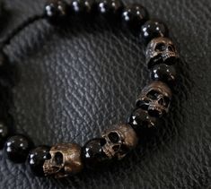 Luxury Black Gemstone Beaded Bracelets, Luxury Onyx Bracelets, Luxury Onyx Bracelets With Black Beads, Half Skull, Ancient Maps, Human Skull, Beaded Skull, Onyx Bead, Conversation Piece